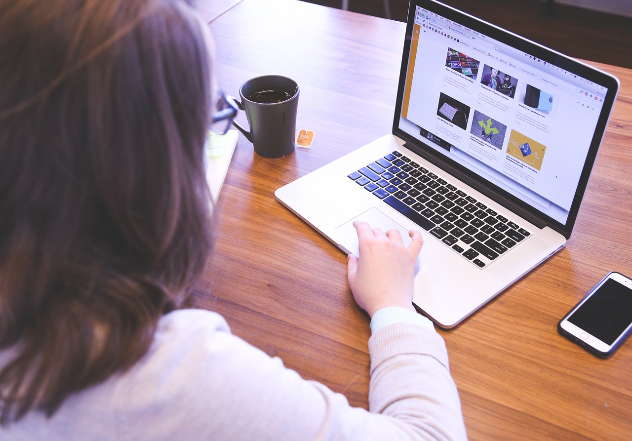 Young person looking at laptop