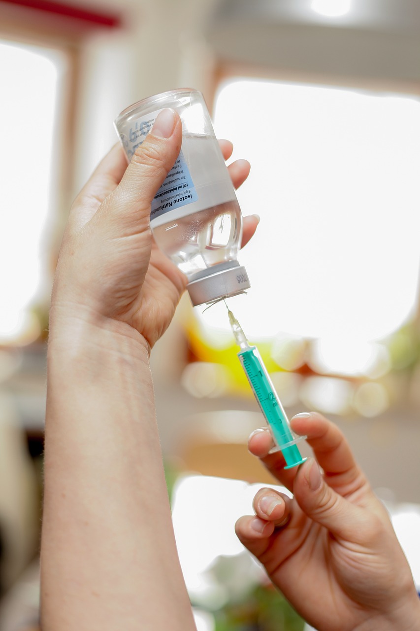 injection being prepared from a bottle